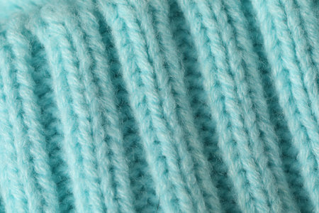 Texture of turquoise wool fabric as background, top view