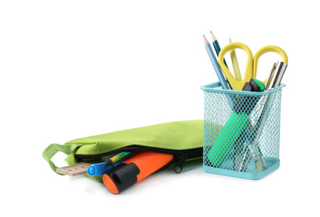 Different stationery in pencil case and pen holder isolated on whiteの写真素材