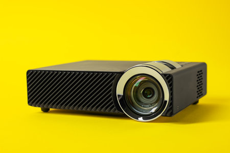 Modern video projector on yellow background, closeupの写真素材