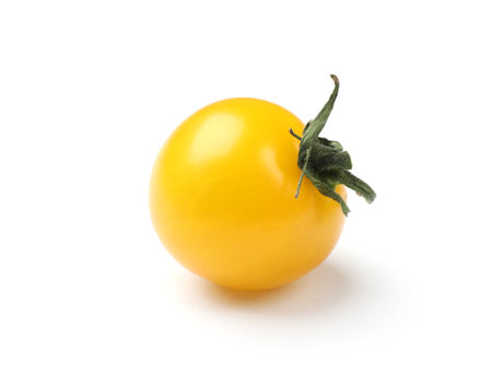 Ripe yellow cherry tomato isolated on whiteの写真素材