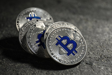 Cryptocurrency. Silver bitcoins on grey table, closeupの写真素材