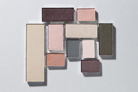 Beautiful eyeshadow refill pans on light background, flat lay