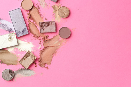 Beautiful eyeshadow refill pans on pink background, flat lay. Space for textの写真素材