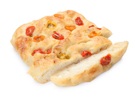Cut delicious focaccia with tomatoes isolated on whiteの写真素材