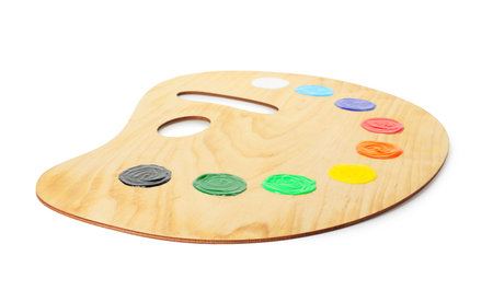 Wooden palette with paints isolated on whiteの写真素材
