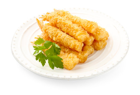 Many tasty tempura shrimps and parsley isolated on whiteの写真素材