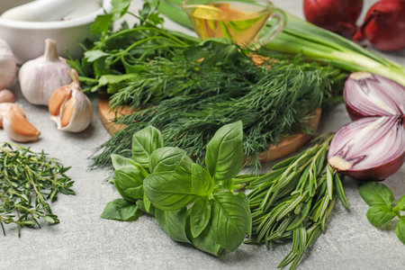 Different herbs and spices on grey table, closeupの写真素材