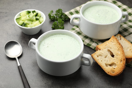 Tasty cucumber soup served on grey table, closeupの写真素材