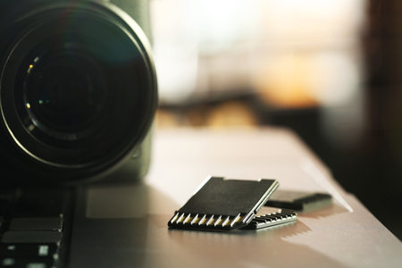SD memory cards and photo camera on laptop, closeupの写真素材
