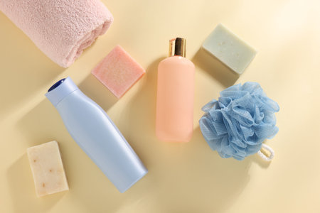 Different bath accessories on yellow background, flat layの写真素材