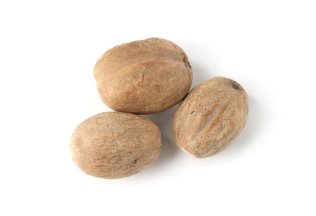 Fresh nutmegs isolated on white, top viewの写真素材