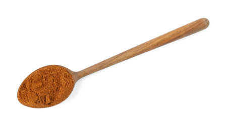 Nutmeg powder in spoon isolated on white, top viewの写真素材