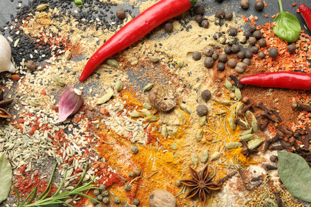 Different aromatic spices on grey table, top viewの写真素材