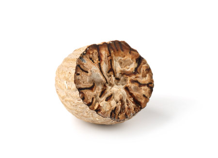 Half of fresh nutmeg isolated on whiteの写真素材