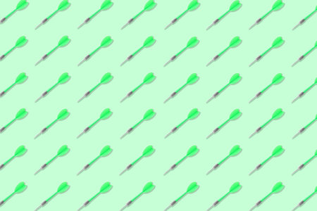 Pattern of darts on light green backgroundの写真素材