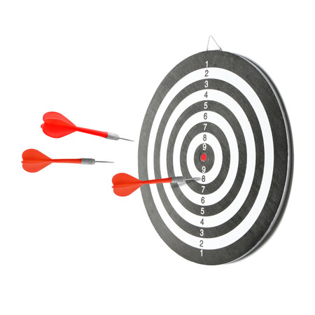 One dart sticking in dartboard and other ones flying on white backgroundの写真素材