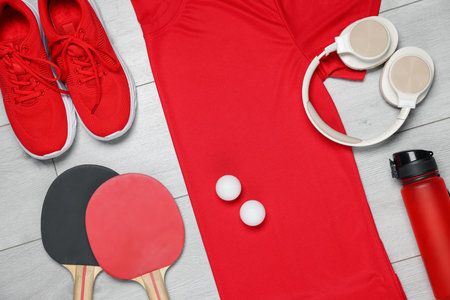 Flat lay composition with sportswear and headphones on floorの写真素材