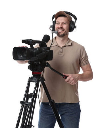 Man with professional video camera and headset on white background