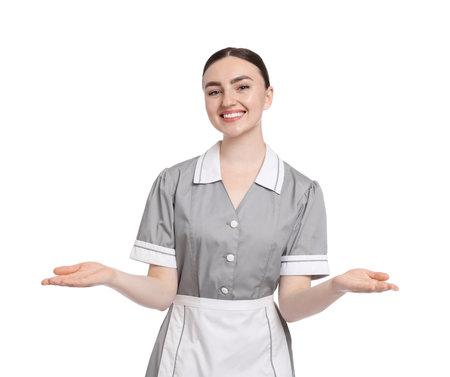 Portrait of happy chambermaid on white backgroundの写真素材