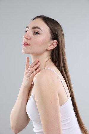 Woman with healthy skin on grey backgroundの写真素材