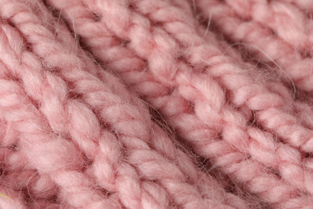 Texture of pink wool fabric as background, closeup