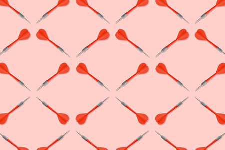 Pattern of darts on light red backgroundの写真素材