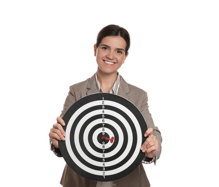 Targeting. Smiling businesswoman with dart board on white backgroundの写真素材