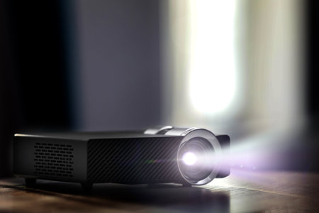 Modern video projector on wooden table indoors. Displaying imageの写真素材