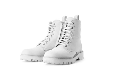 Pair of stylish white boots on white backgroundの写真素材