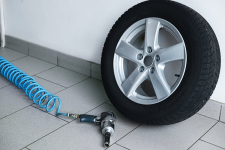 New tire and impact wrench gun at car service