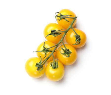 Branch with yellow cherry tomatoes isolated on white, top viewの写真素材