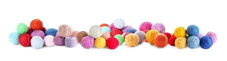 Knitting threads in different colors isolated on whiteの写真素材