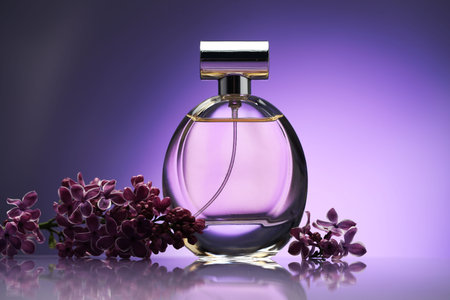 Beautiful lilac flowers and perfume on mirror surface against purple gradient background