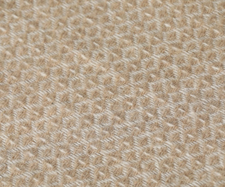 Texture of beige wool fabric as background, top view
