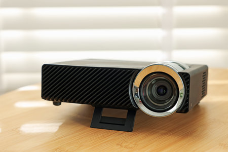 Modern video projector on wooden table indoors, closeupの写真素材