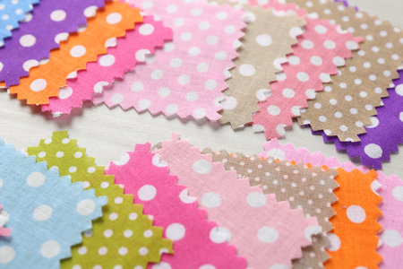 Samples of different fabrics on white wooden table, closeupの写真素材