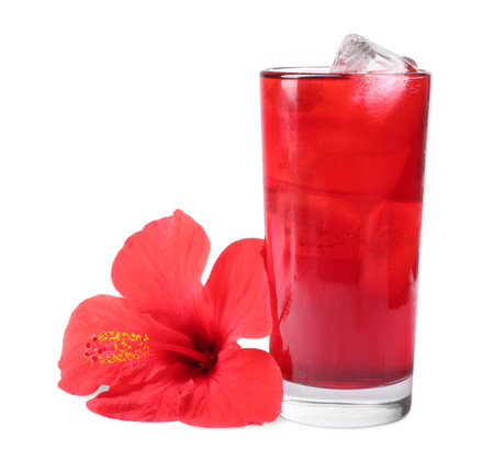 Delicious hibiscus tea with ice cubes in glass and beautiful flower isolated on whiteの写真素材