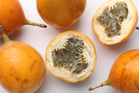 Ripe passion fruits on white background, flat layの写真素材