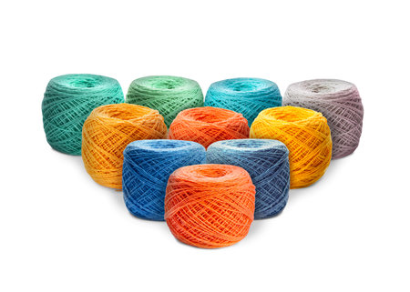 Knitting thread in different colors isolated on white