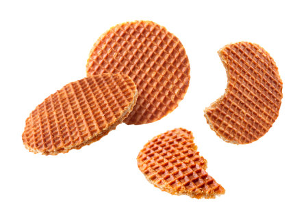 Yummy Dutch waffles (stroopwafels) flying on white backgroundの写真素材