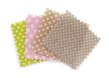 Samples of fabrics with polka dot pattern isolated on white, top view
