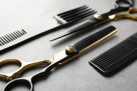 Different hairdresser's tools on grey table, closeupの写真素材