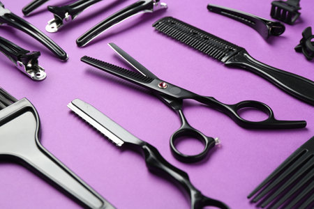 Different hairdresser's tools on violet background, closeupの写真素材