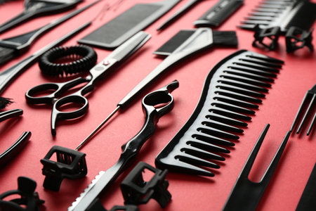 Different hairdresser's tools on red background, closeupの写真素材
