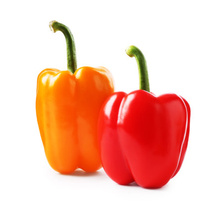 Ripe colorful bell peppers isolated on whiteの写真素材