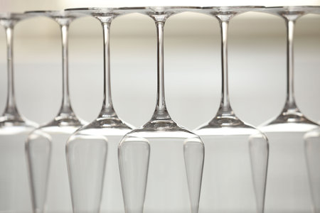 Upturned empty clean glasses on blurred background, closeupの写真素材