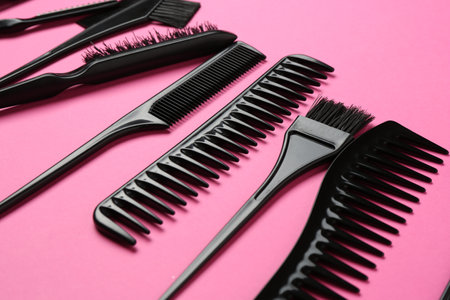 Different hairdresser's tools on pink background, closeupの写真素材