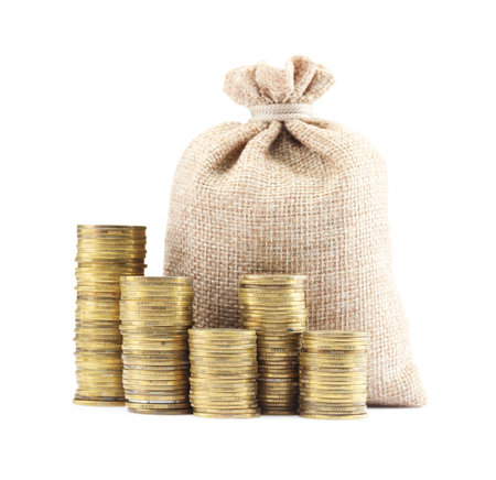 Bag and stacked coins isolated on whiteの写真素材