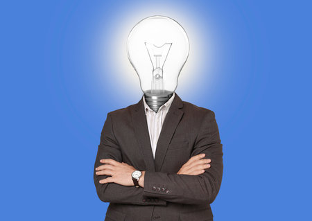 Man with glowing light bulb instead of head on blue backgroundの写真素材