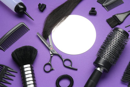 Different hairdresser's tools on purple background, above viewの写真素材